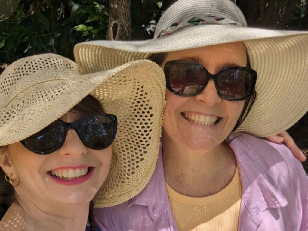 Author Ann-Marie and her friend wearing sunglasses and hat