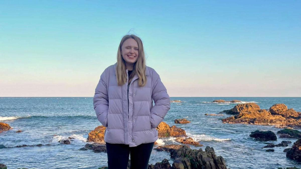 Author Bethan enjoying a walk along the coast in Gijang during the winter