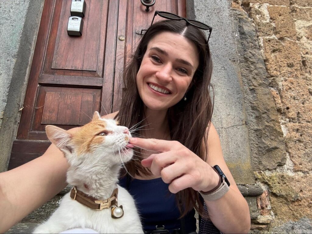 Author Betty playing with a local cat