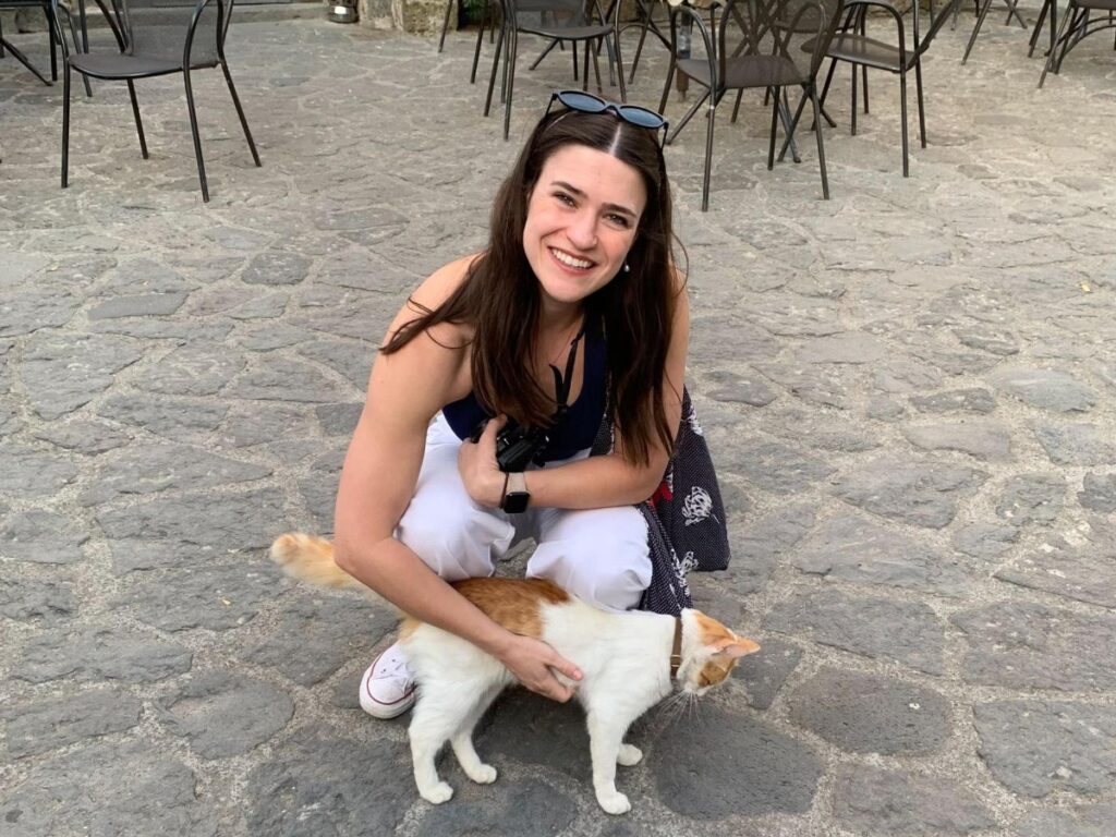 Author Betty playing with a village cat