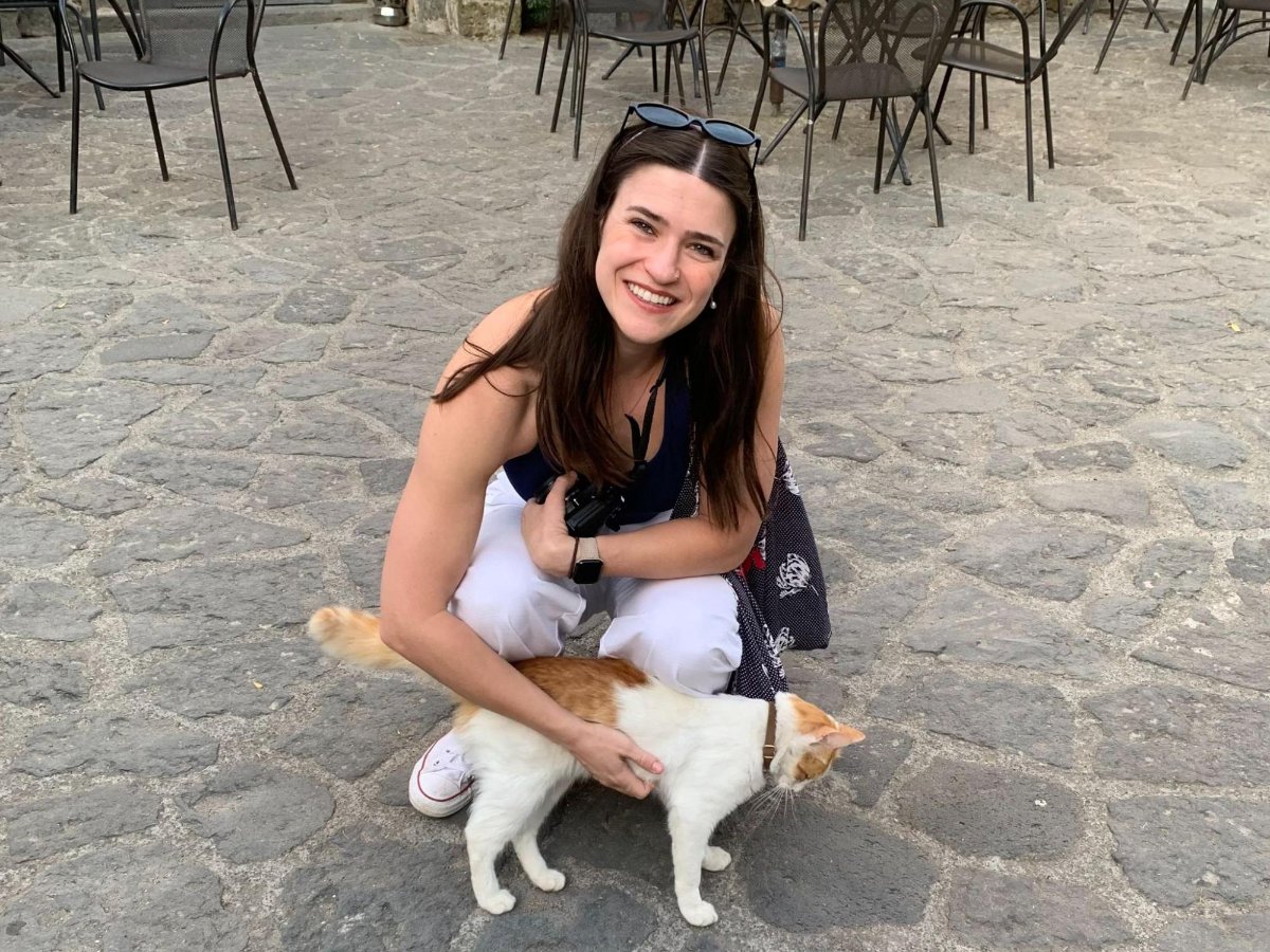 Author Betty playing with a village cat