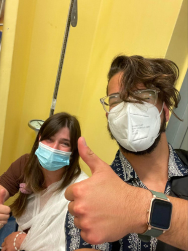 Author Betty and friend giving a thumbs up on a hospital