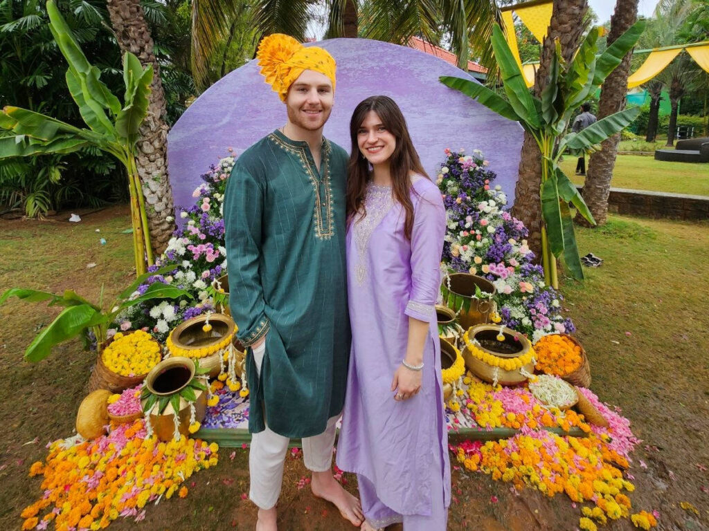 Author Betty and her boyfriend standing in front of the Haldi setting