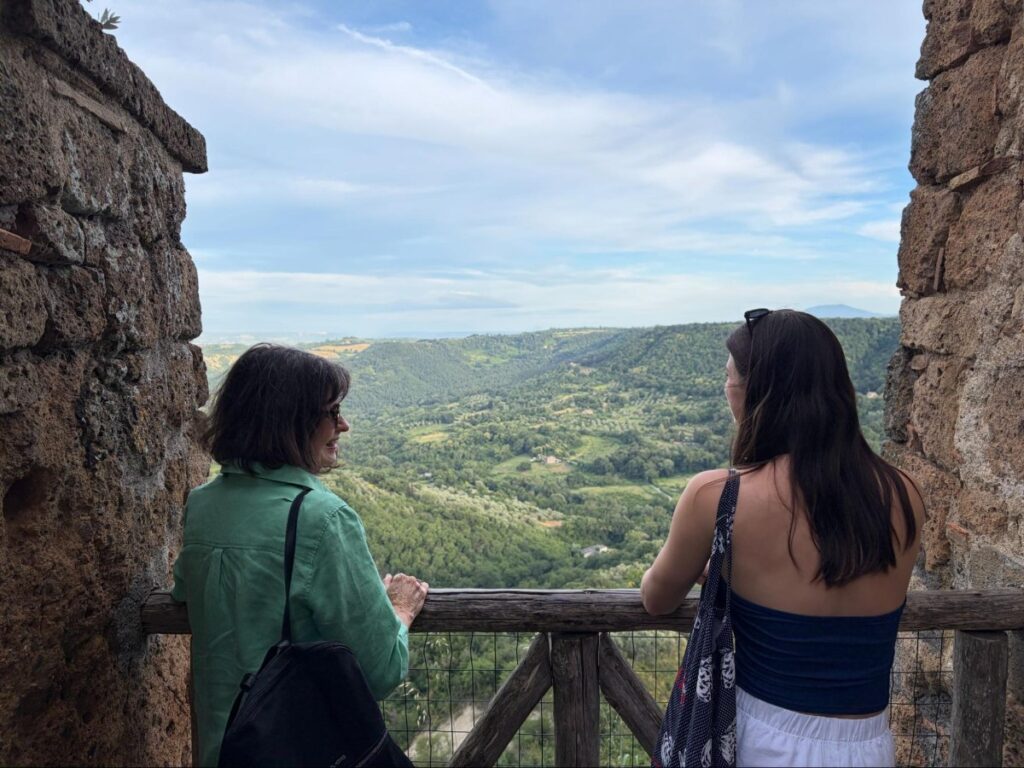 Author Betty and her mom at a lookout with views over the valley