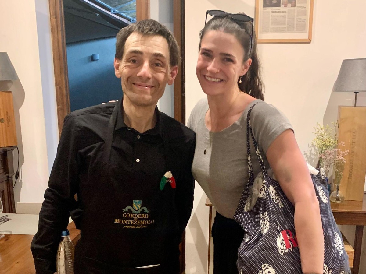 Author Betty taking a picture with their restaurant server