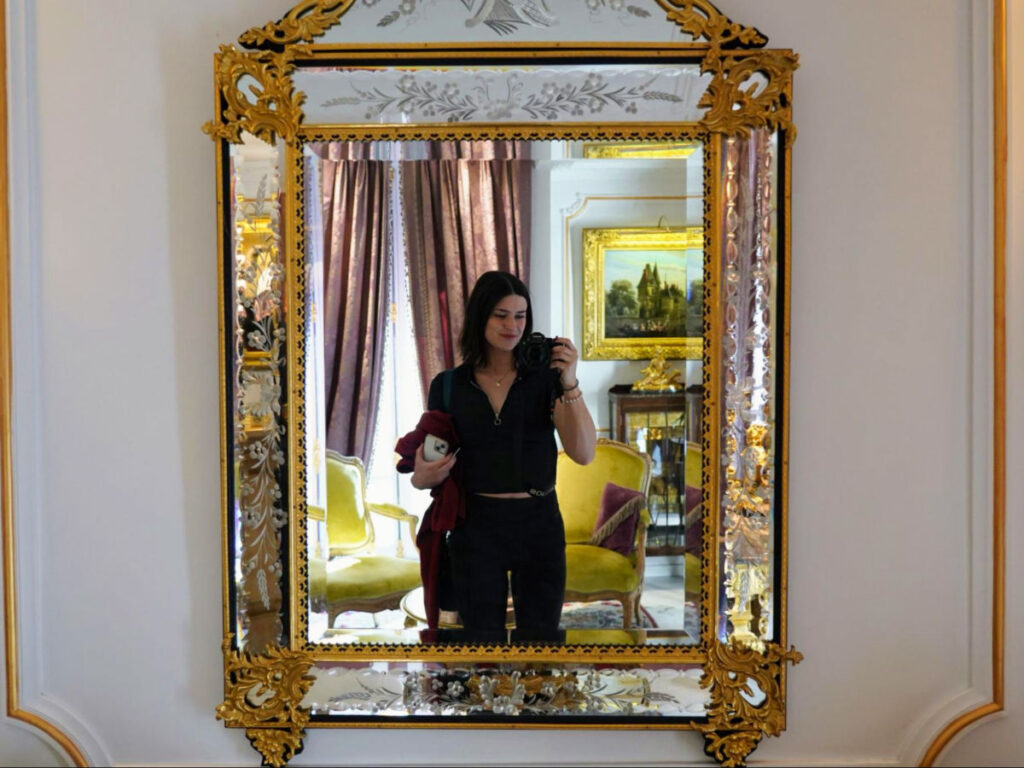 Author Betty taking a mirror selfie at Hôtel Académie Saint-Germain