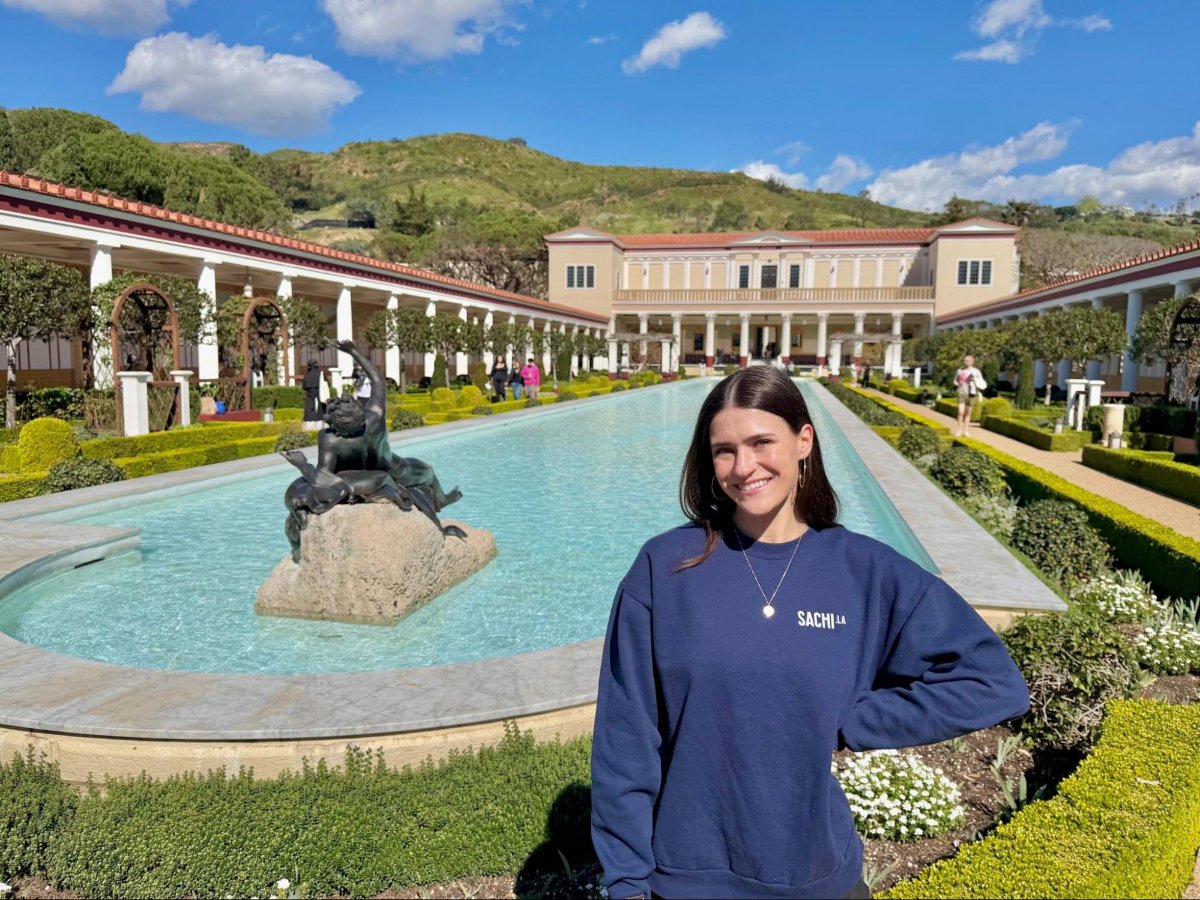 Author Betty near the reflection pool of Getty Villa