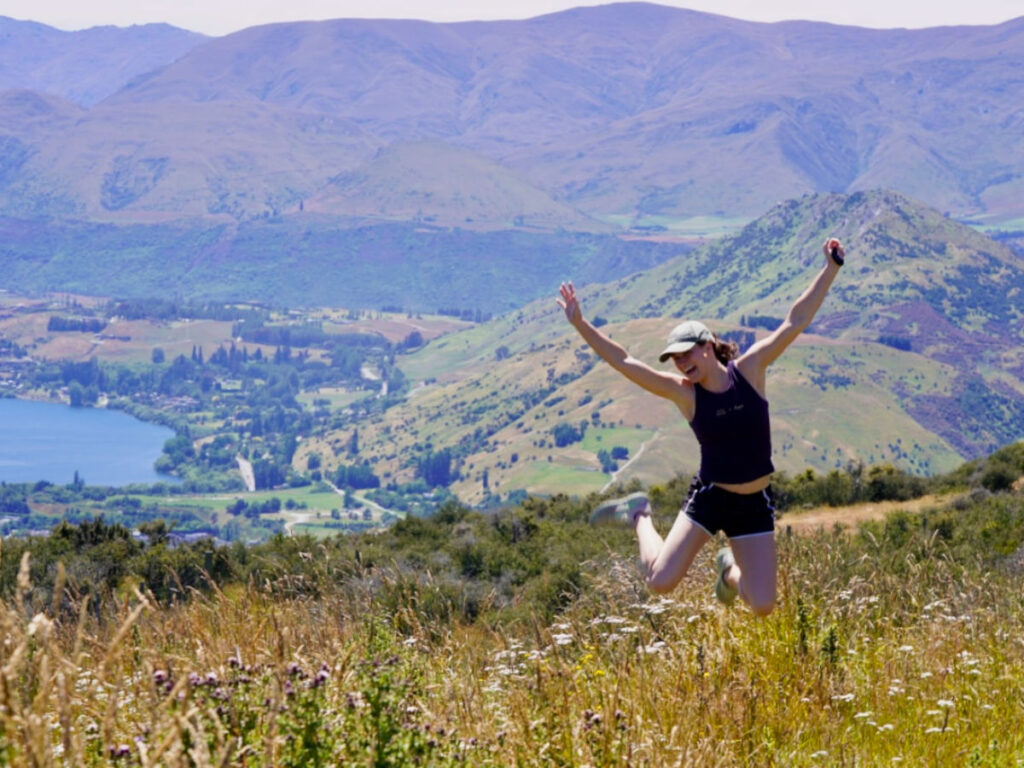 Author Betty doing a jump shot at the access road up to the ski valley trail