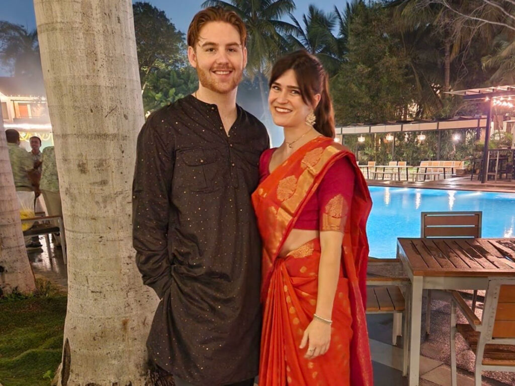 Author Betty and her boyfriend at the wedding venue near the pool