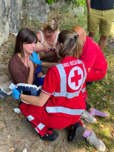 Author Betty being checked by paramedics specifically her collarbone
