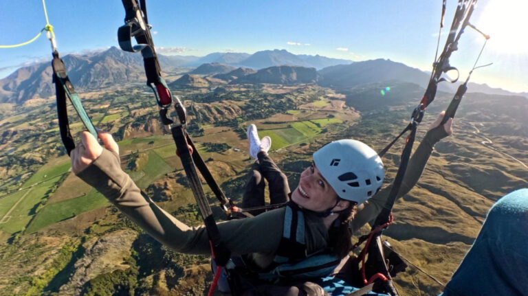 Author Betty enjoying the views while gliding over Wakaitpu Valley in Queenstown