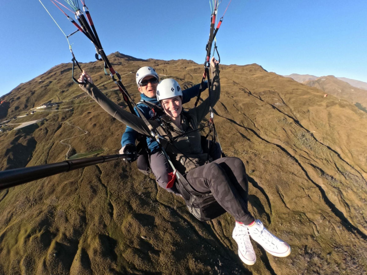 Author Betty gliding over Wakaitpu Valley while pilot is taking a selfie