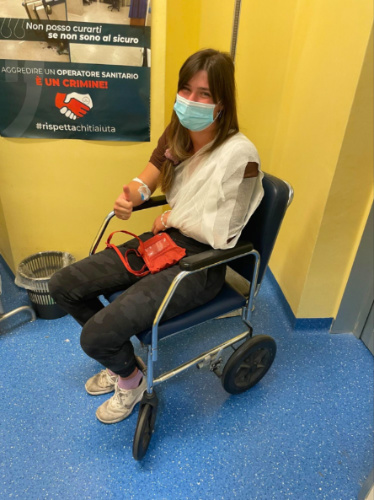 Author Betty on a wheelchair showing the okay sign