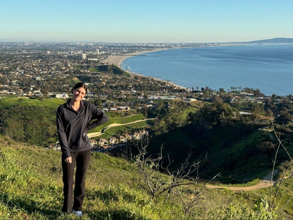 Author Betty on the Paseo Miramar Trail with a view of the ocean