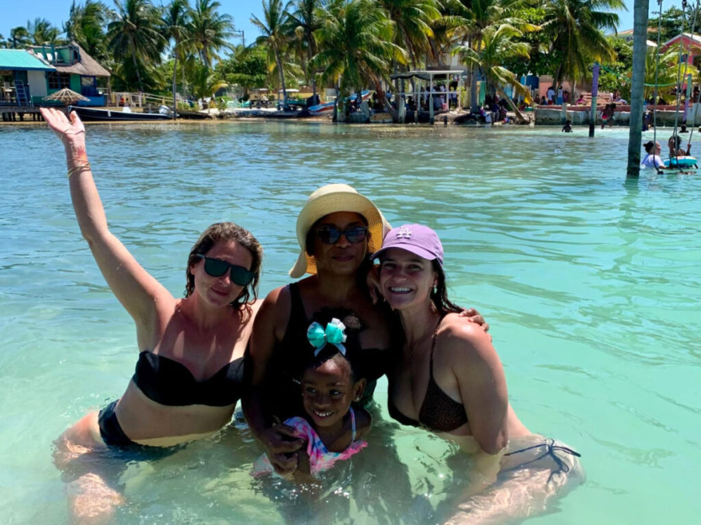 Author Betty swimming with new friends in Caye Caulker