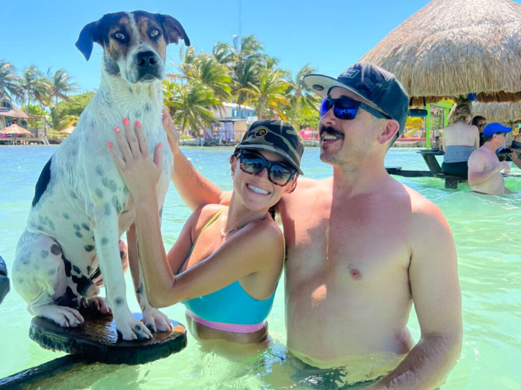 Author Betty swimming with the dog in Caye Caulker