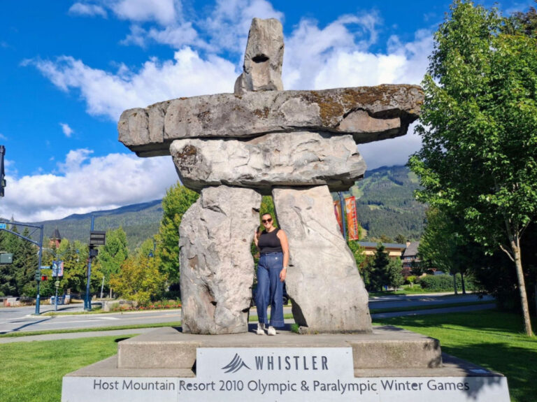 Author Catherine standing at Whistler’s Inukshuk