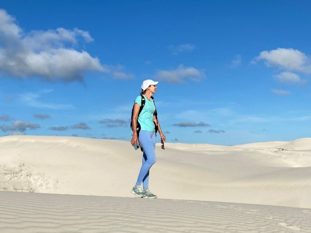 Author Elise walking on sand dunes in De Hoop Nature Reserve