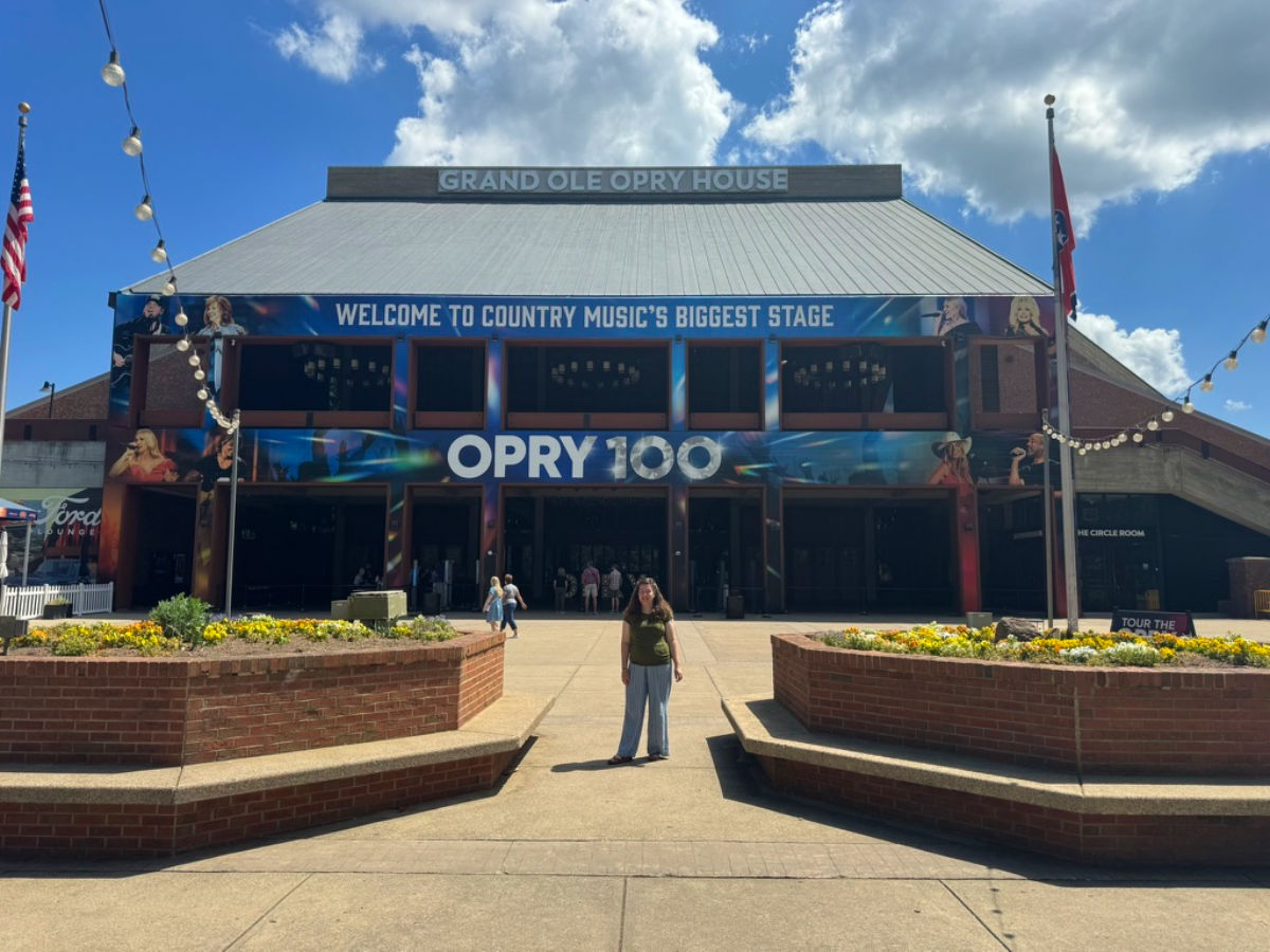 Author Elizabeth standing outside the  Grand Ole Opry House