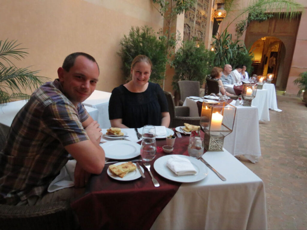 Author Heather with her husband having a candlelit dining at  La Maison Arabe