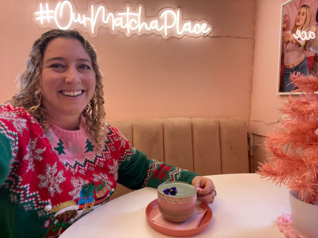 Author Jess enjoying a cup of butterfly pea-infused matcha latte at Our Matcha Place