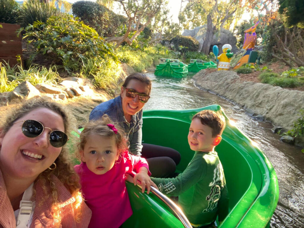 Author Jess and her family on the Fairy Tale Brook ride at Legoland