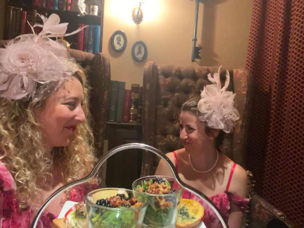 Author Jess and her friend dressed up for an Authentic British afternoon tea destination