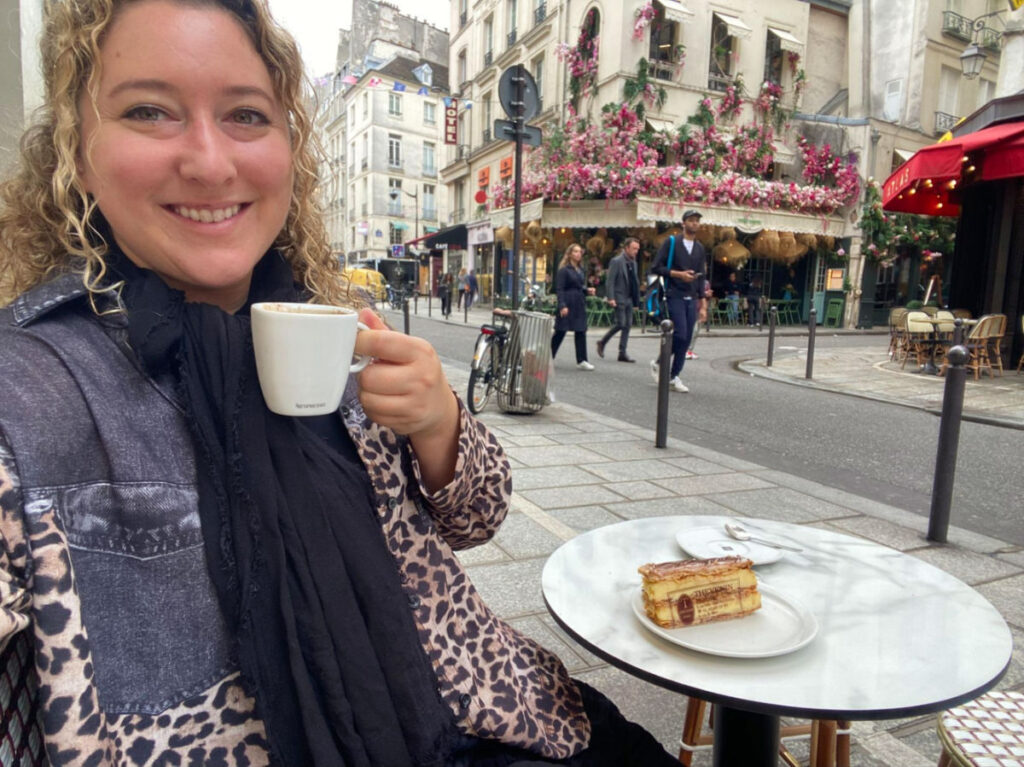 Author Jess enjoying coffee and desert on the streets