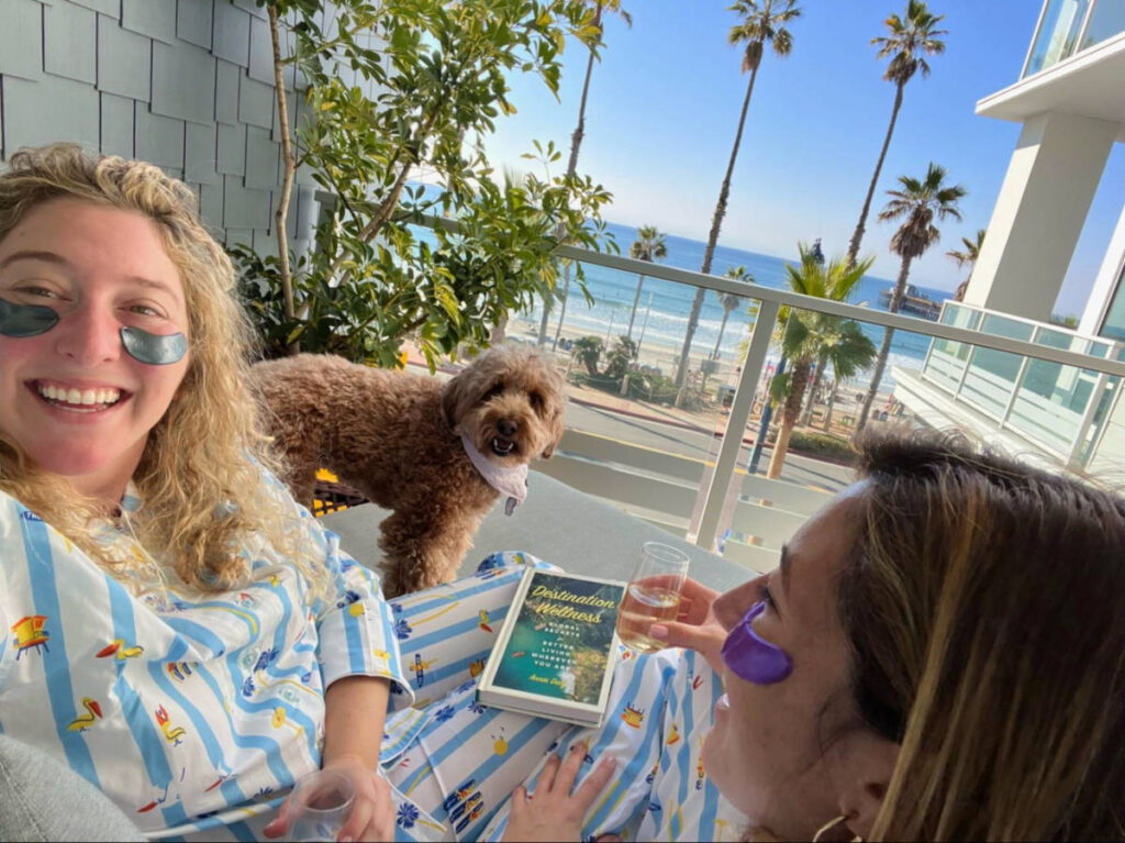 Author Jess with her friend and dog relaxing on a resort