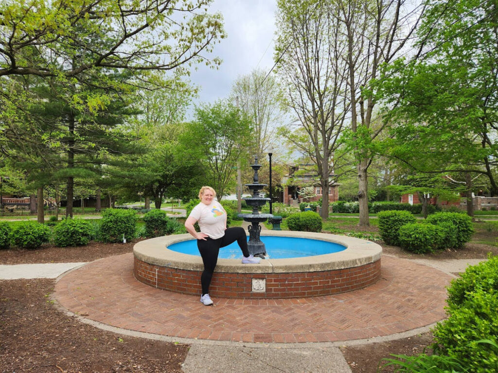 Author Kelsey near the fountain at Irving Circle Park in Irvington
