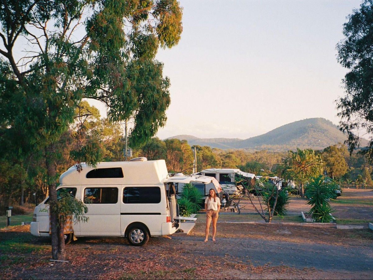 Author Laura posing near the campervan at their campsite