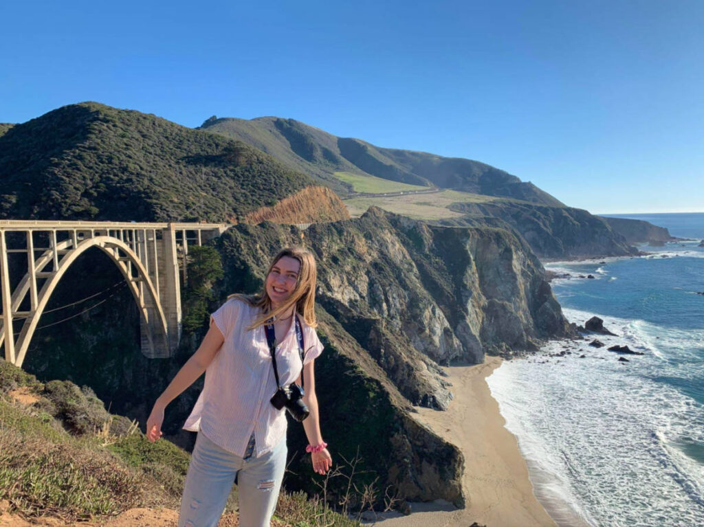 Author Laura standing in front of the Bixby Creek Bridge