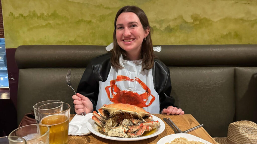 Author Laura eating the giant crab at Thanh Long