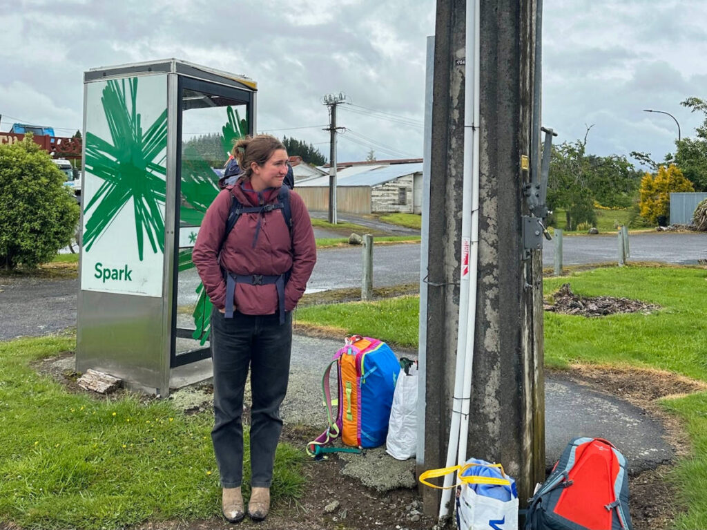 Author Laura waiting for the bus in the North Island