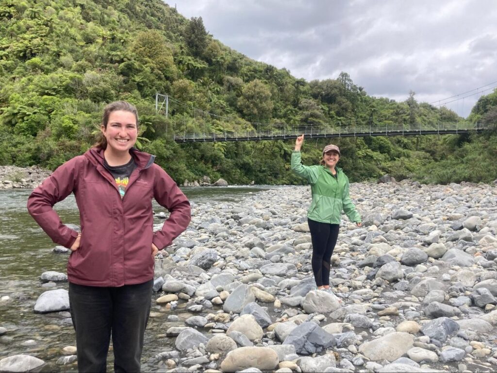 Author Laura and her partner crossing a creek