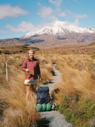 Author Laura backpacking with Mt. Ruapehu in the background
