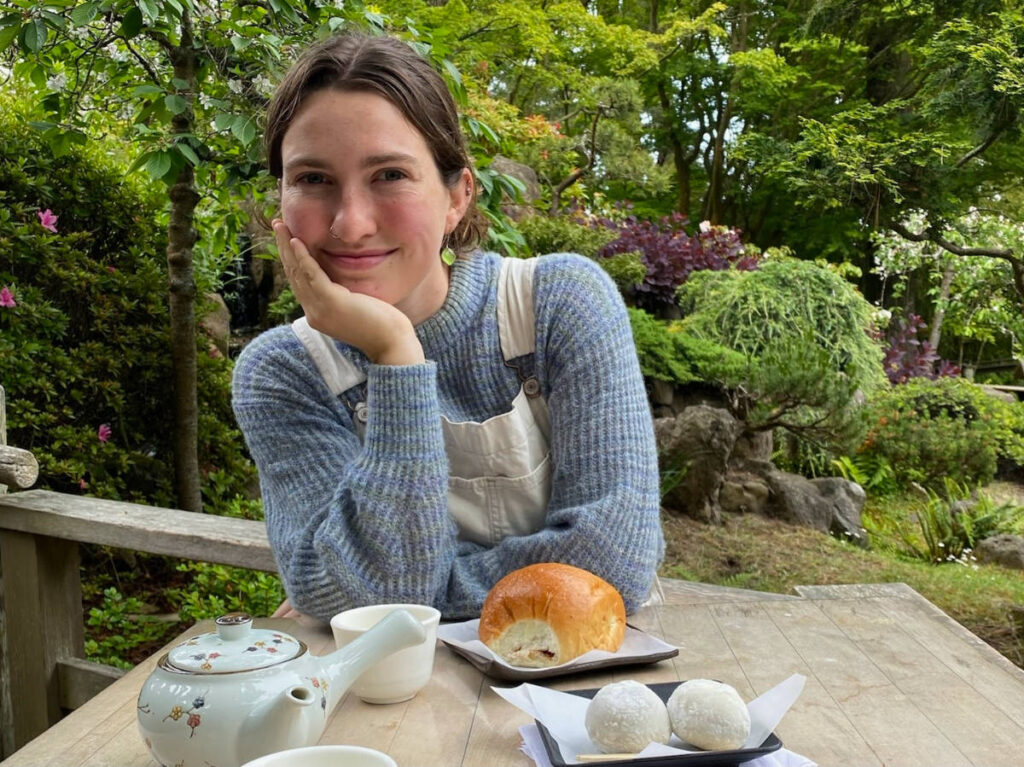 The author Laura McFarland smiling for a photo on a Japanese Tea Garden