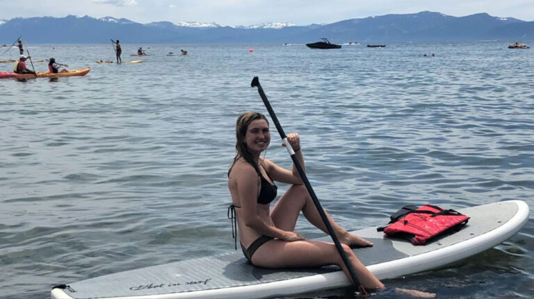 Author Laura paddleboarding in Kings Beach, Lake Tahoe