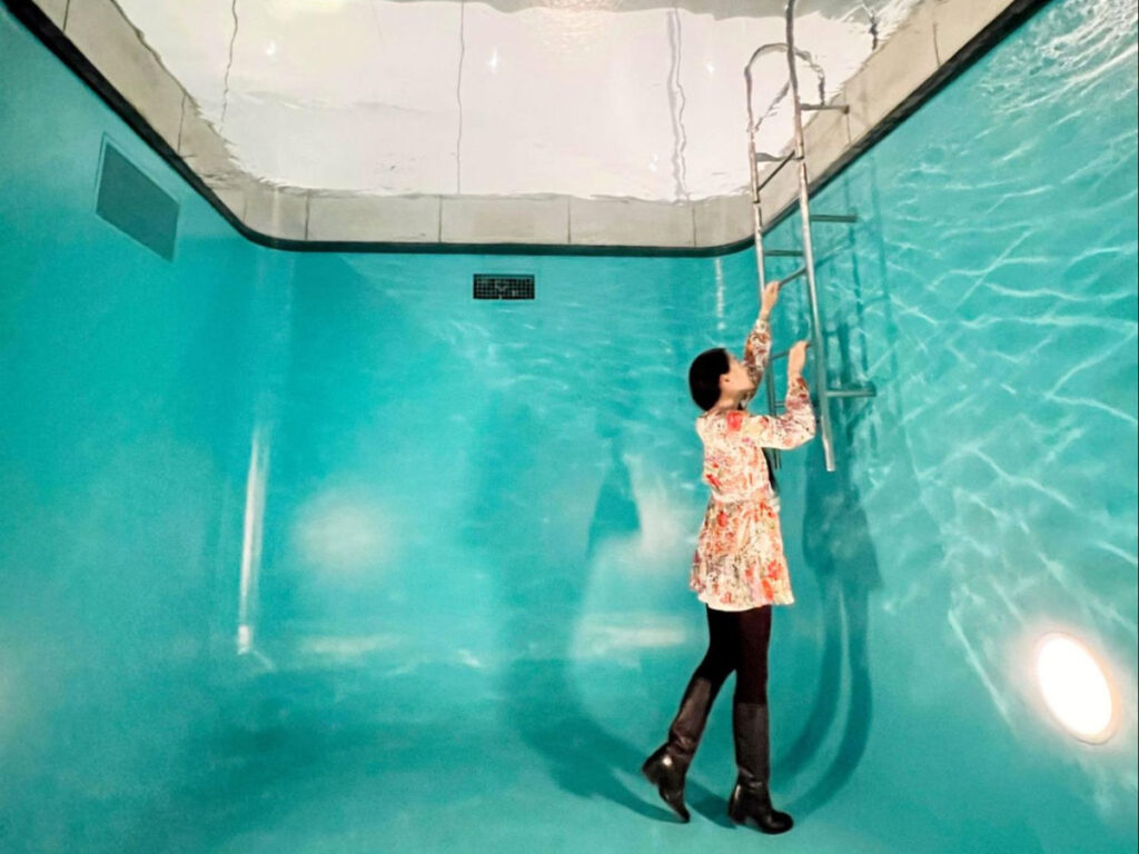 Author Lia taking a photo at the Swimming Pool installation in The 21st Contemporary Museum of Art
