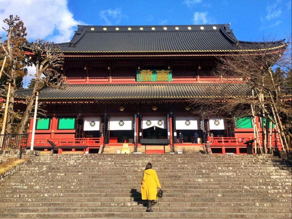 Author Lia going up the stairs to the Rinnoji Temple