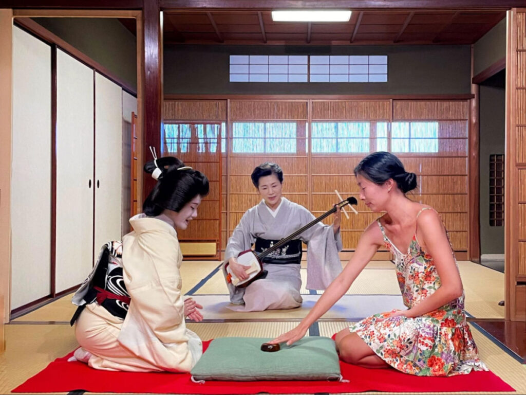 Author Lia playing traditional games with the Geiko of Kanazawa