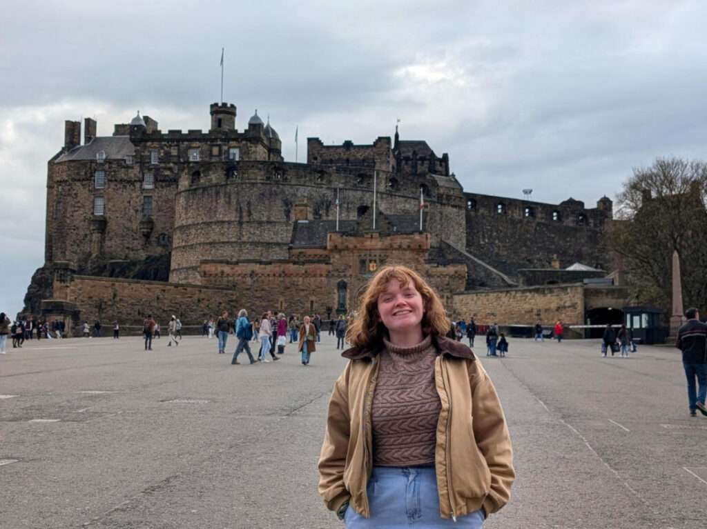 Author Louise standing outside Edinburgh Castle