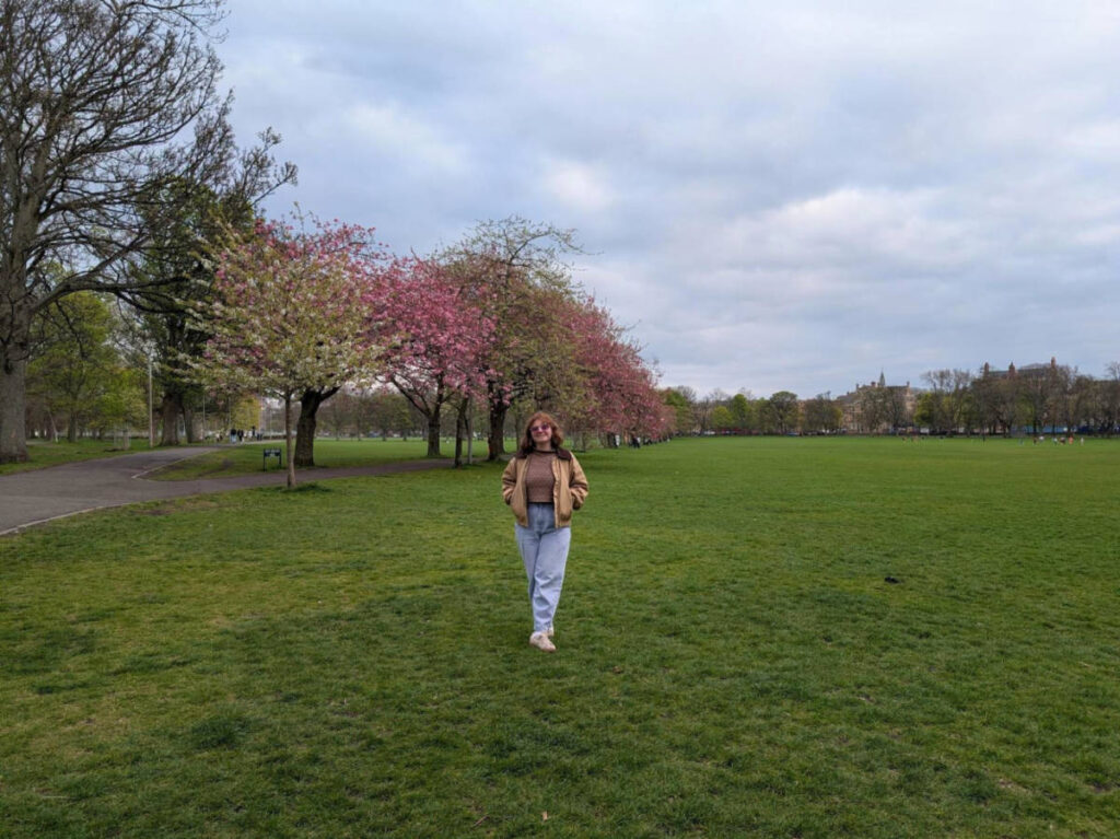 Author Louise standing in the Meadows on a sunny day