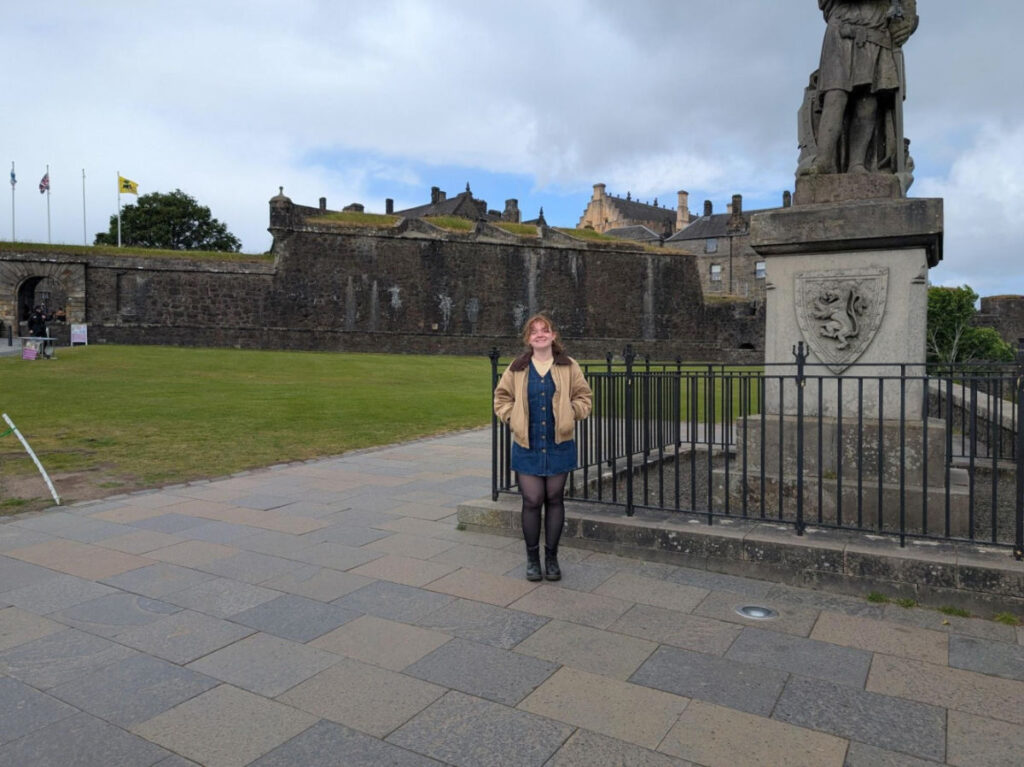 Author Louise standing outside Stirling Castle