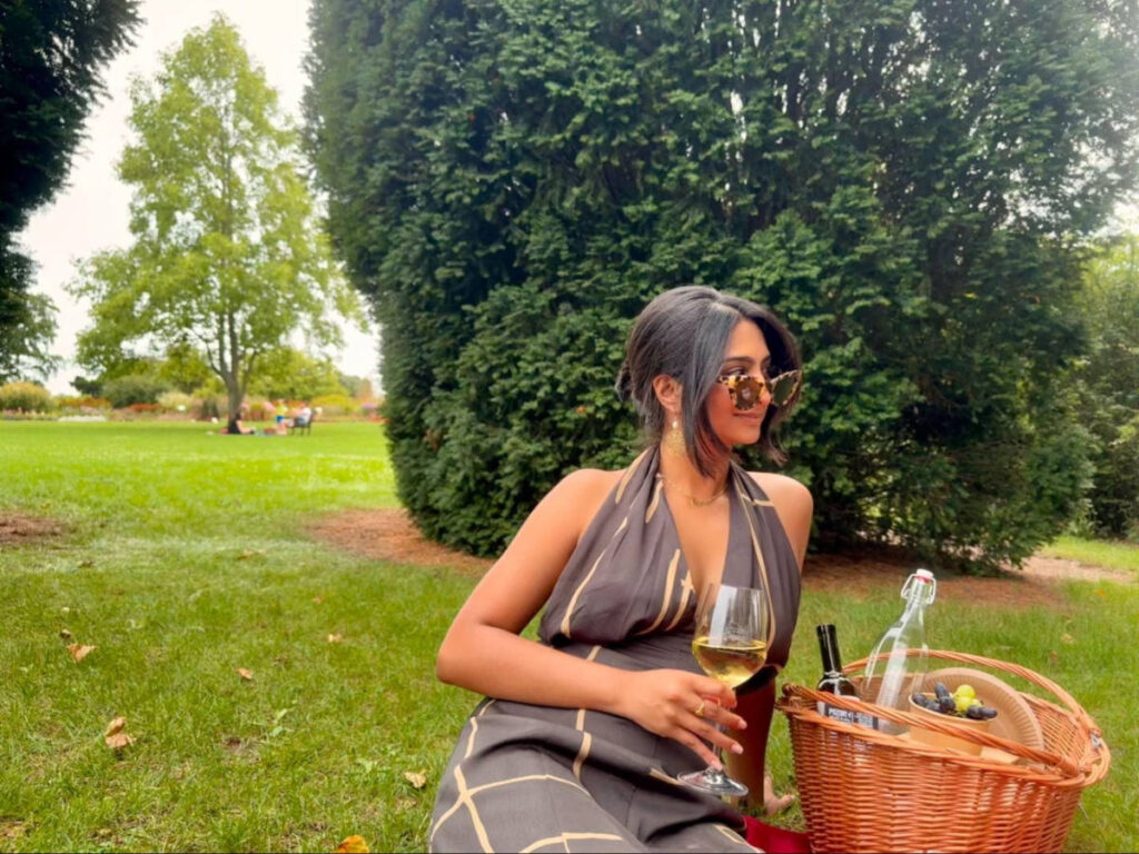 Author Meera enjoying a wine at St. Claire’s Vineyard