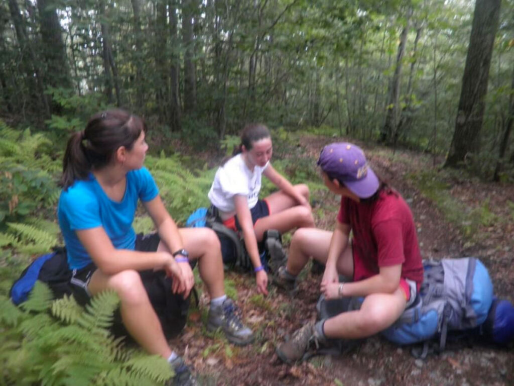 Author Meg and her friends resting on the Appalachian Trail