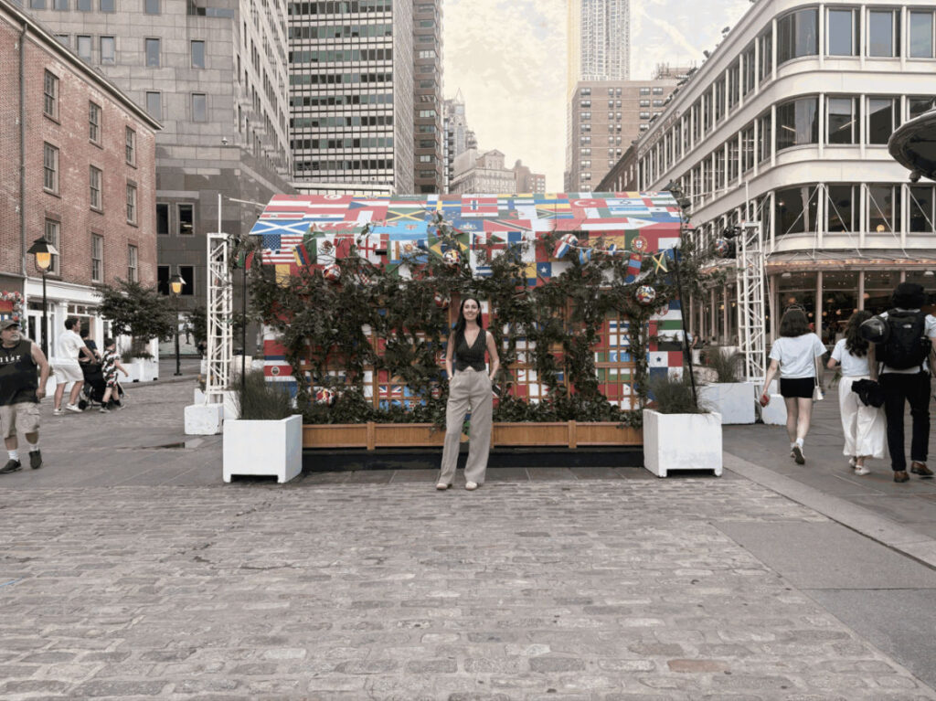 Author Niamh standing on South Street Seaport’s cobblestone streets