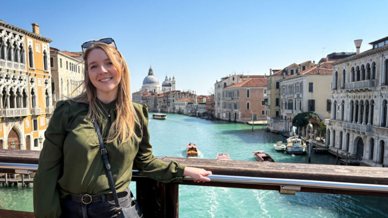 Author Taylor Herperger, enjoying the overlooking view of the canal at Ponte dell'Accademia