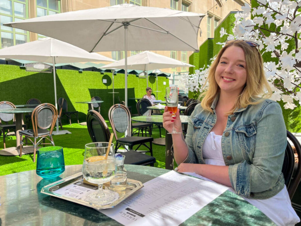 Author Taylor enjoying a drink at The Sunset Terrace