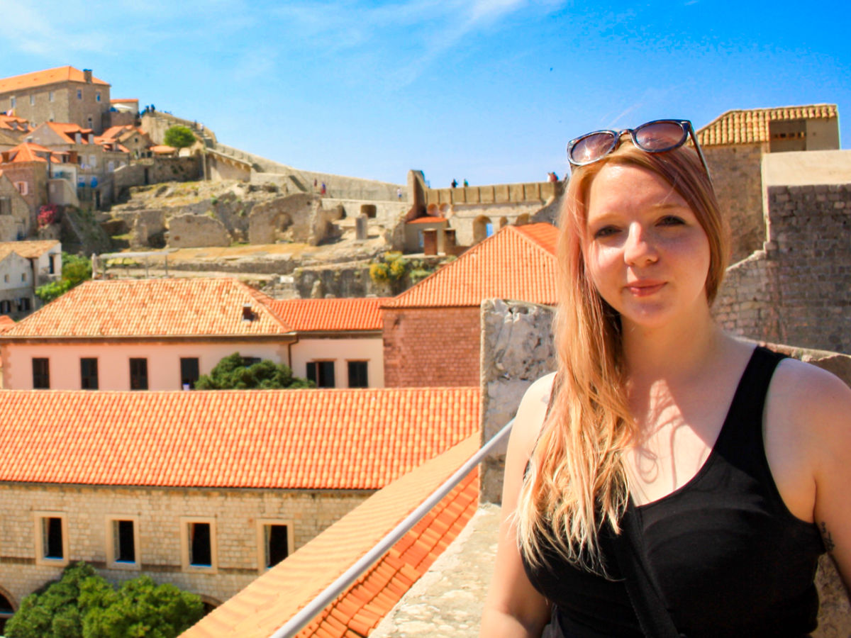 Author Taylor at the Dubrovnik City Walls in a sunny day